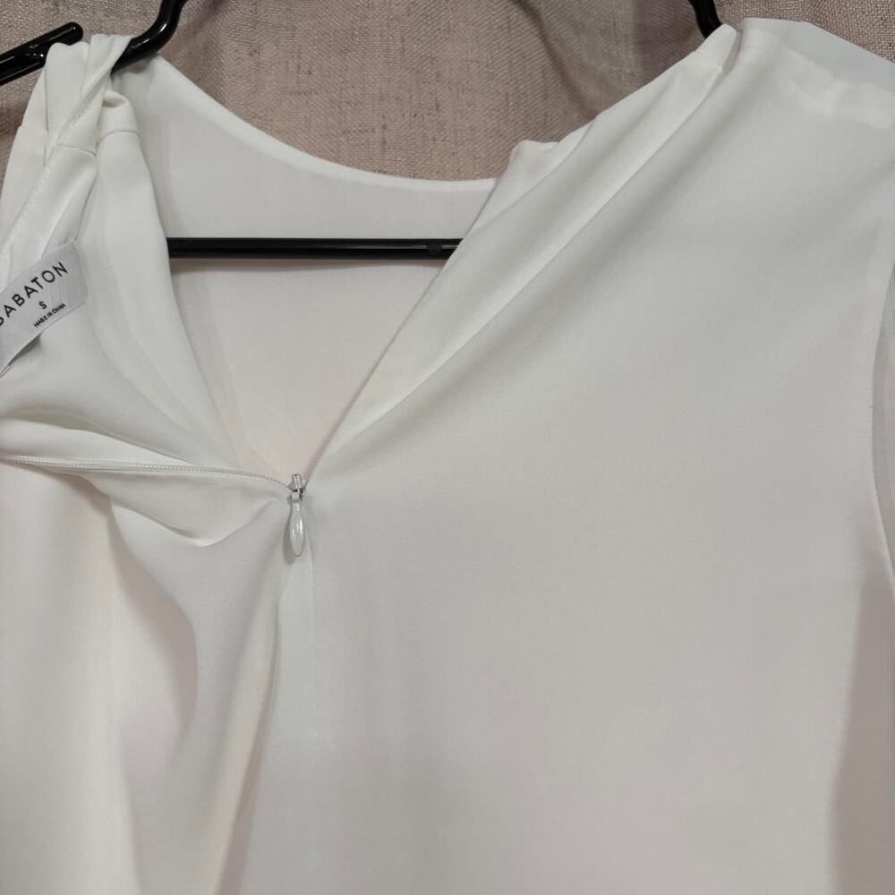White asymmetrical hem top with